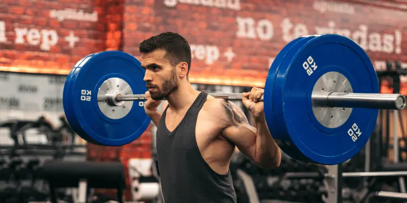 man performing squat exercise