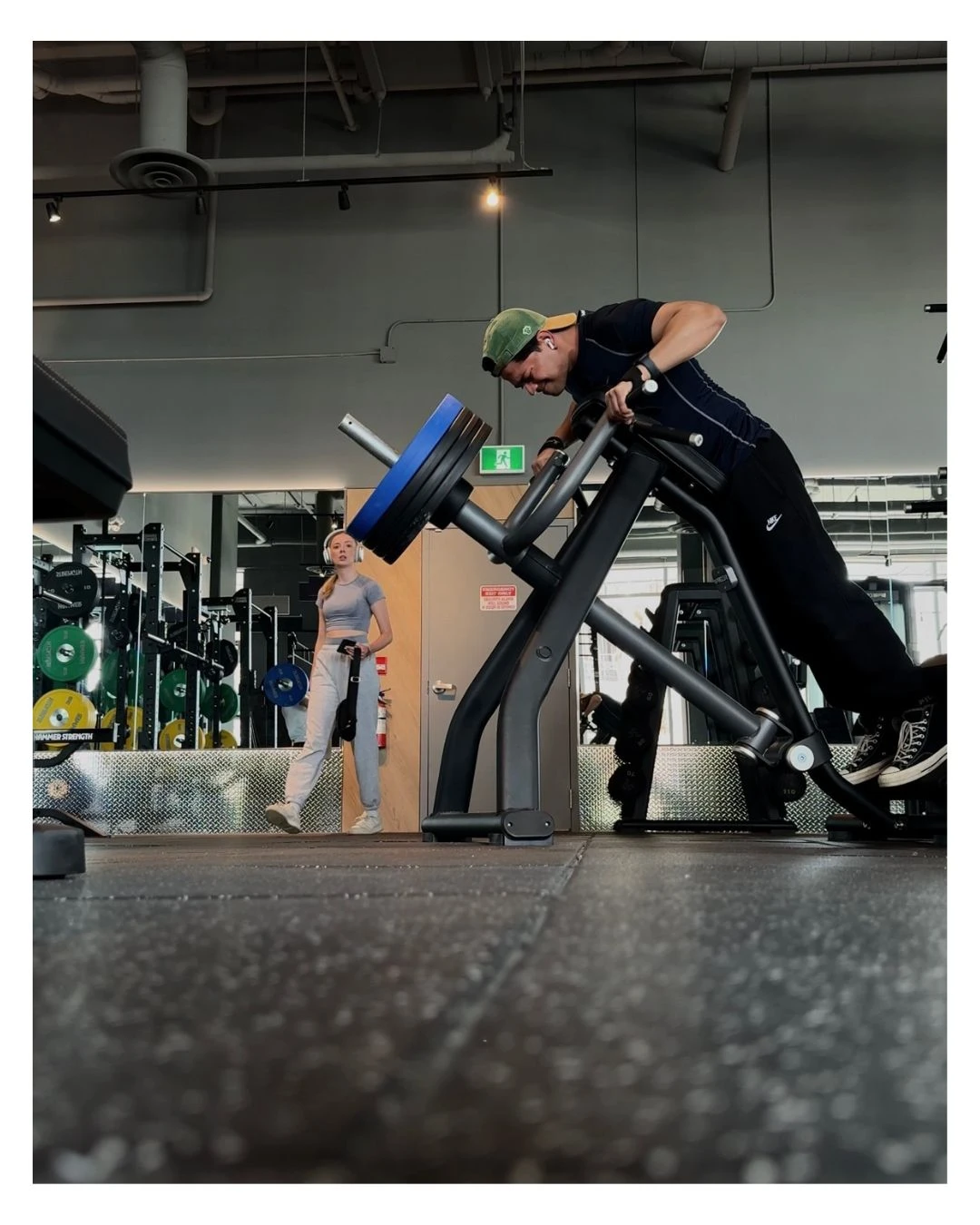 Mehul Ahire demonstrating strength training exercise on specialized gym equipment